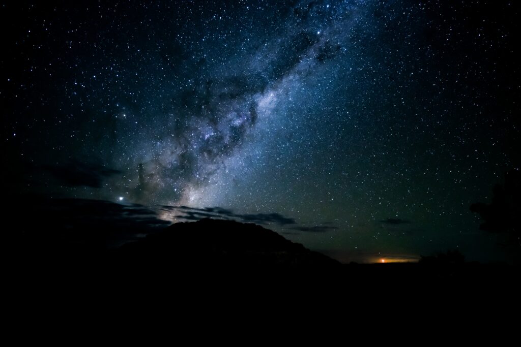 breathtaking shot silhouettes hills starry sky night